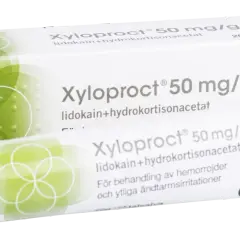 Xyloproct salva mot hemorrojder. Förpackning och tub med salva för behandling av hemorrojder och ändtarmsirritationer.