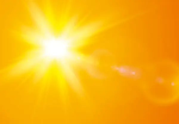 En bländande nysa av solen lyser upp en varm, orange bakgrund med strålar och linsöverstrålning.